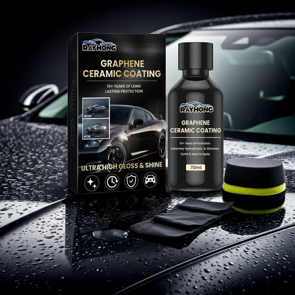Rayhong Graphene Ceramic Coating kit displayed on a wet car hood, including the black product box, a black bottle, two applicator cloths, and a sponge, with a blurred car background.